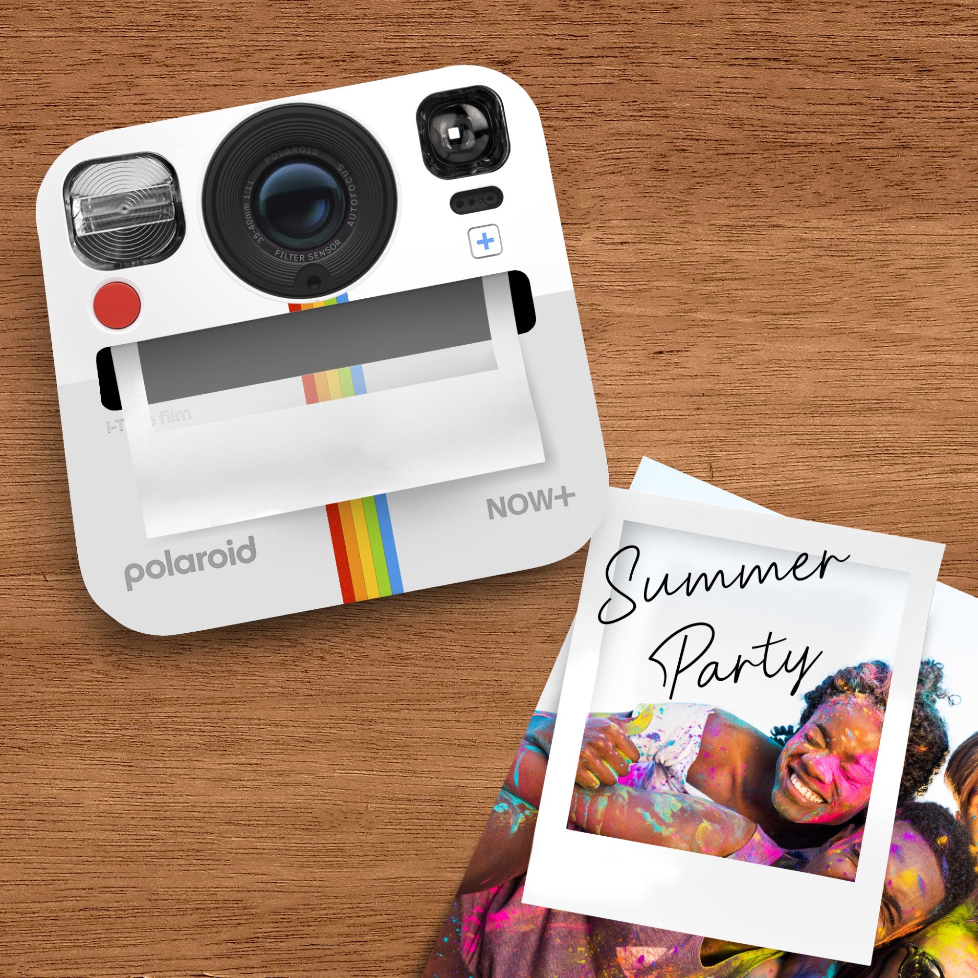 Polaroid camera-shaped sticky note dispenser on a wood desk with colorful photo and notes