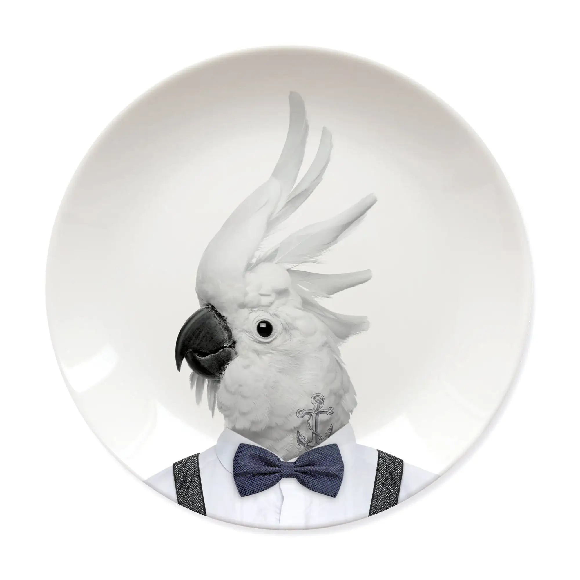 Ceramic plate featuring a cockatoo in a shirt, suspenders, and bow tie with anchor tattoo.